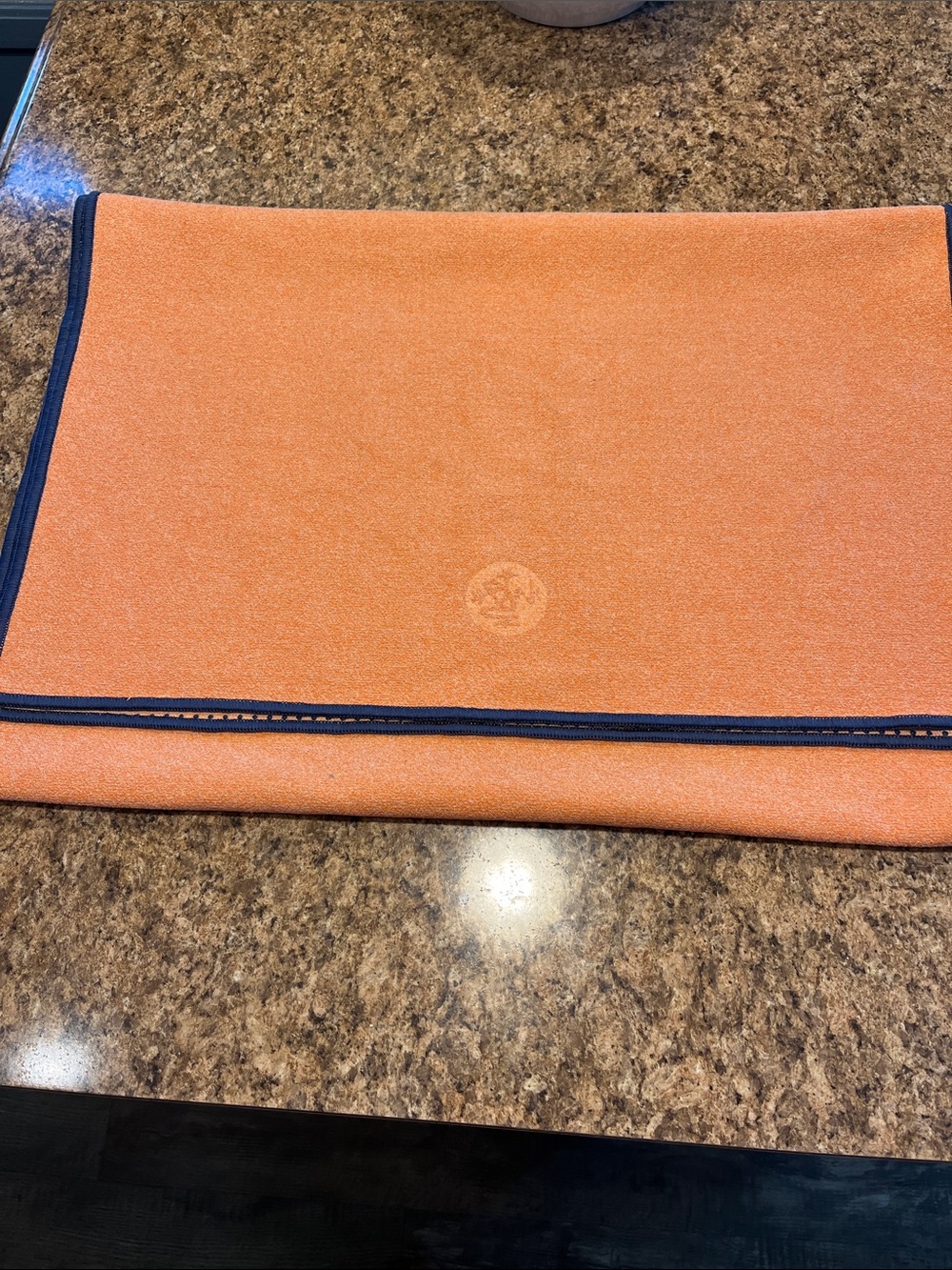 Manduka Yogitoes Orange Yoga Towel with Navy Edge with skidless technology